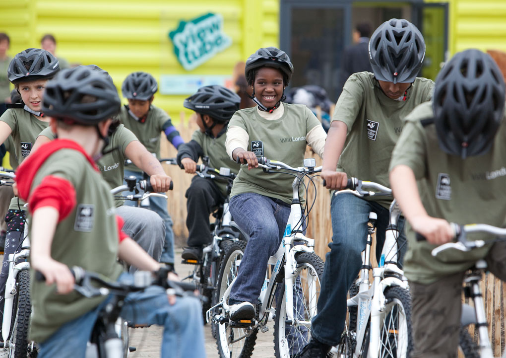 school pupils setting off on a bike ride