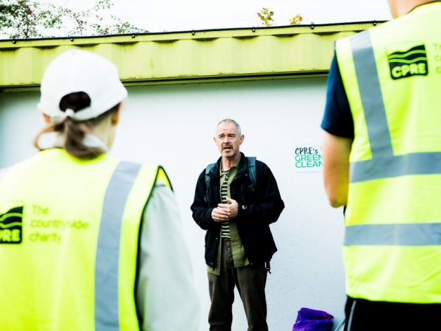 Man speaking to volunteers before litter pick
