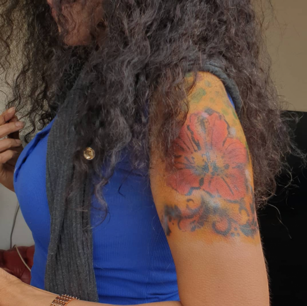 Flower tattoo on a woman's arm