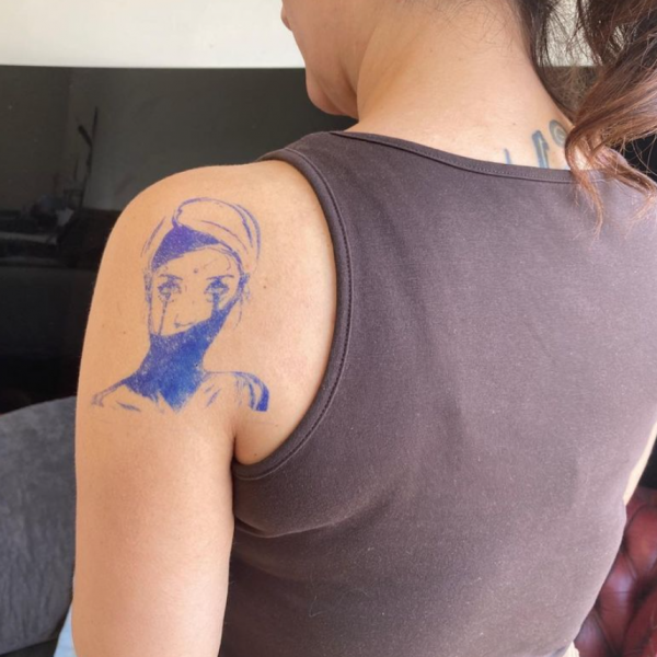 Arm tattoo of a woman